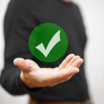 Businessman showing green check mark. Concept of correct decisio Businessman showing green check mark. Concept of correct decision
